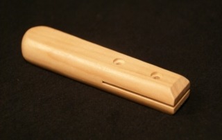 Flat wooden handle featuring cross bore holes and slotted ends, designed for barbecue utensils, cutlery, and spatulas.